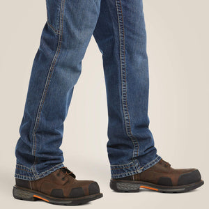 Close up of a man wearing Ariat FR M4 Boot Cut Jean