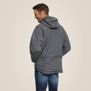 Back view of a man wearing grey Ariat stretch FR jacket