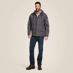 A man wearing grey Ariat stretch FR jacket