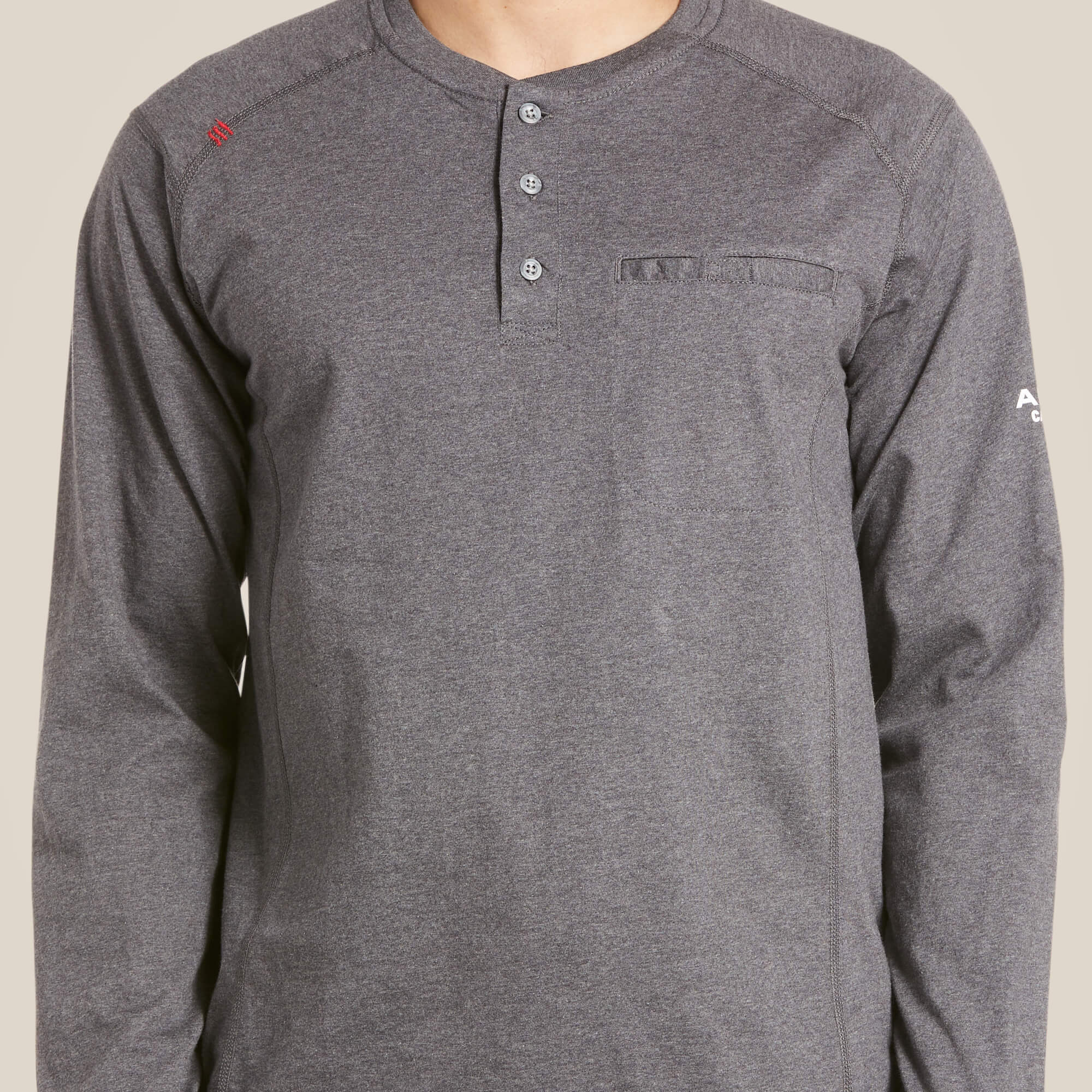 Zoomed in grey Ariat FR Henley shirt